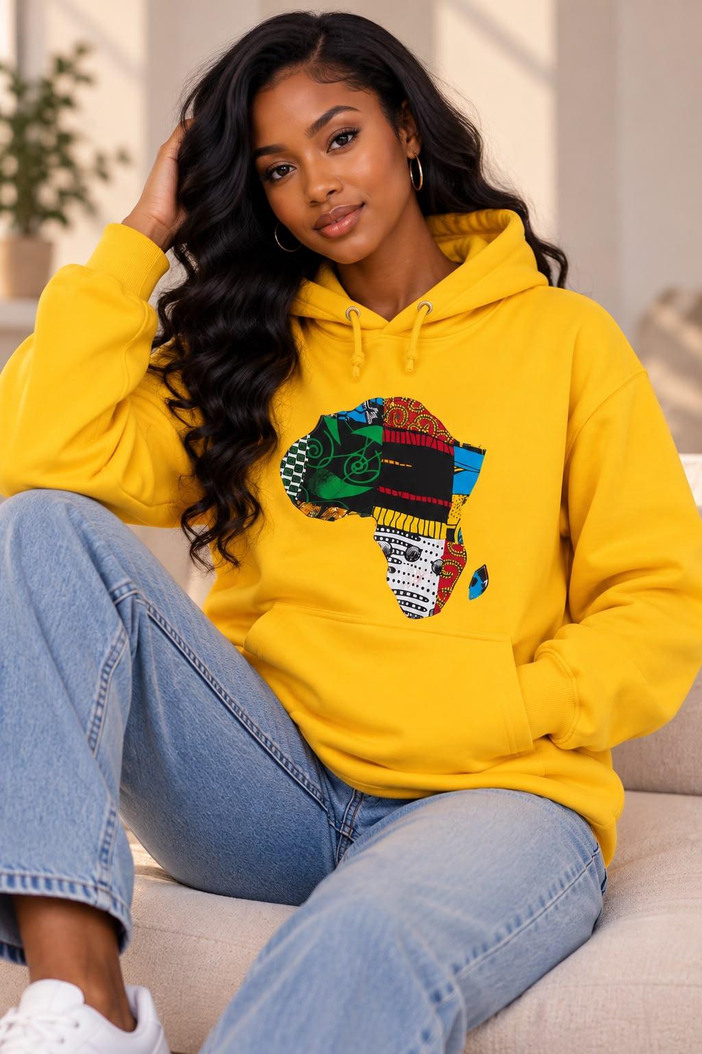Woman wearing the yellow African Heritage Print hoodie