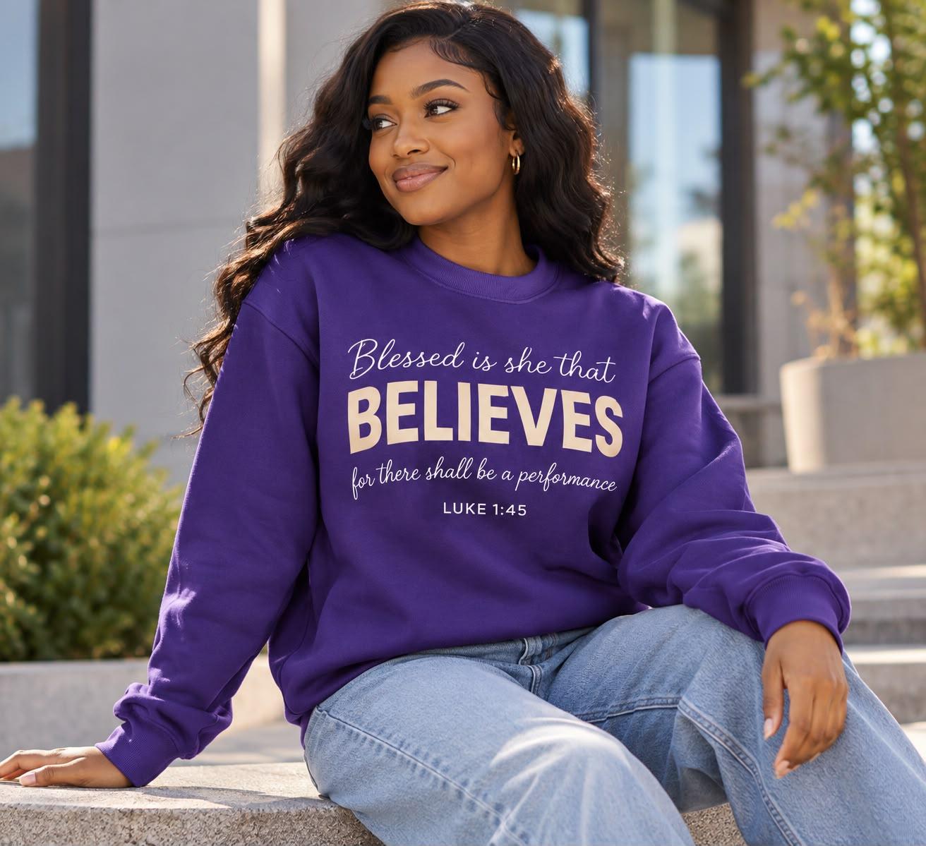 Woman wearing the purple Believes crewneck